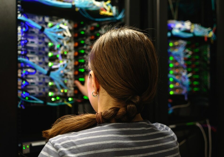 Woman,Network,Engineer,Near,Working,Server,Rack.,Data,Center,In